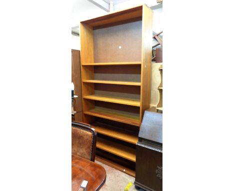 A 1.08m stained mixed wood seven shelf open bookcase - 2.25m high