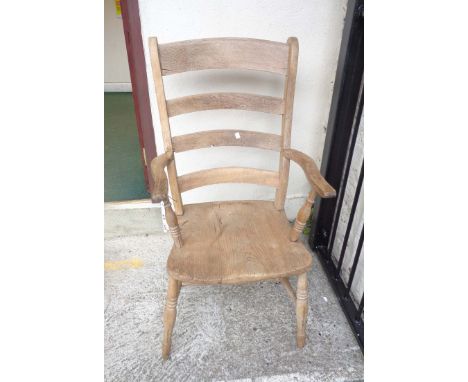 A 19th Century ladder back elbow chair
