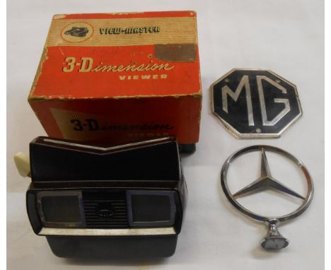 A boxed vintage Viewmaster with disc slides - sold with an MG and Mercedes car badge