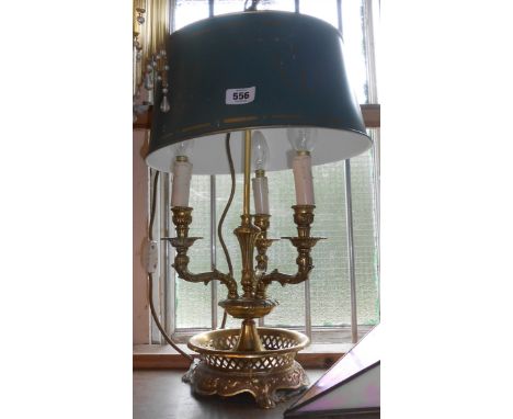 A vintage cast brass three branch table lamp with pierced gallery and toleware shade