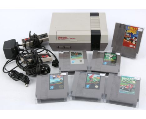 Nintendo Entertainment System (NES) loose console/cartridge bundle (PAL) Includes: Loose console (NES Version), 2 official co