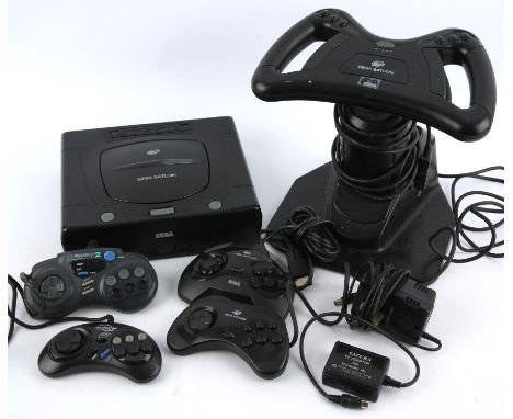 SEGA Saturn loose console/peripheral bundle (PAL) Includes: SEGA Saturn console, Arcade Racing wheel, 4 controllers and AC ad