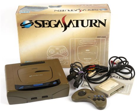 SEGA Saturn Console (HST-0001) Japanese Launch Model Item is complete and boxed though does have notable yellowing to its har