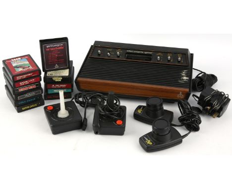 Atari CX-2600 loose bundle (PAL) Includes: Console, Paddle controller, Joystick (x2), third-party power supply and 11 games G
