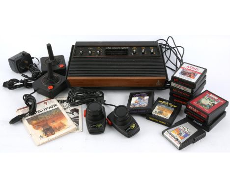 Atari CX-2600 loose bundle (PAL) Includes: Console, Paddle controller, Joystick (x2), official power supply and 11 games Game
