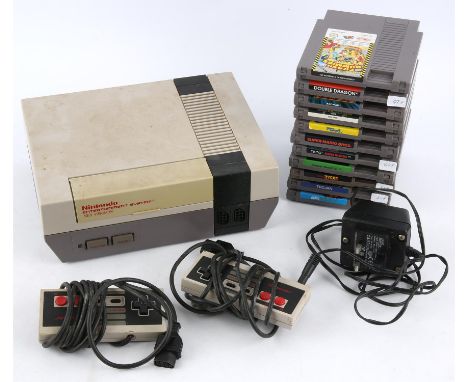 Nintendo Entertainment System (NES) loose console/cartridge bundle (PAL) Includes: Loose console (NES Version), 2 official co