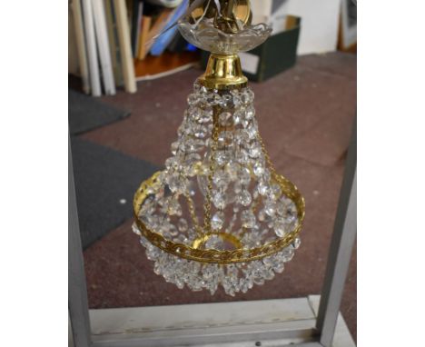 A vintage hanging crystal drop chandelier with metal hanging frame, 18" by 23", the chandelier itself measures 9"x15". Not te