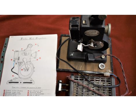 Pathé 'Kid' 9.5mm film projector. Produced in the 1930's It was basic and washand cranked. Comes with transformer and an A4 p