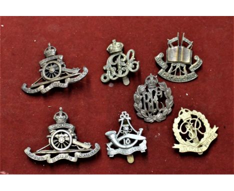 British Military Cap Badges (7) including: Army Educational Corps, Royal Flying Corps, Royal Artillery, Warwickshire Royal Ho