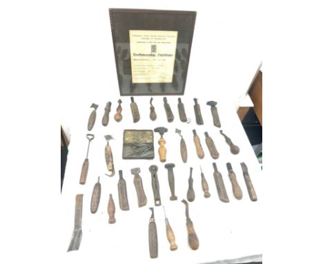 Selection of vintage shoe makers wooden tools together with a Craftmanship certificate 
