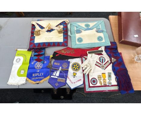 Selection of vintage masonic jewels and aprons 
