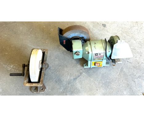 Vintage shapening stone and a bench grinder 