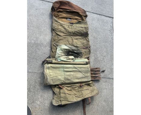Army camp bed with a burberry sleep bag 