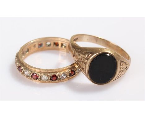 Two 9 carat gold rings, the first a signet ring set with onyx, the second an eternity ring, total weight 5.2 grams