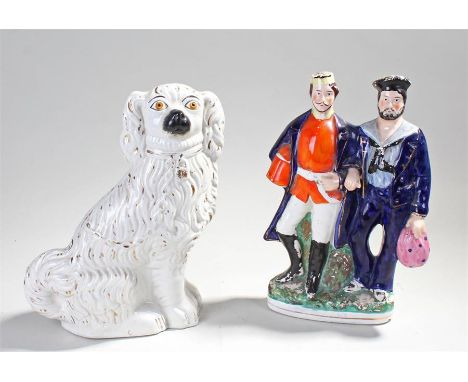 Staffordshire figure of a soldier and a sailor, together with a mantelpiece dog (2) 