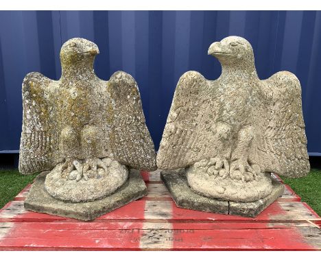 Pair composite stone perched eagle figures/gate post toppers with spread wings, on hexagonal slab base - THIS LOT IS TO BE CO