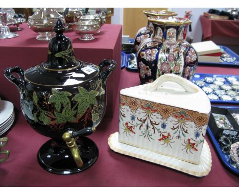 A XIX Century Tea Urn, on a black ground with floral decoration brass top, together with a XIX Century triangular shapes chee