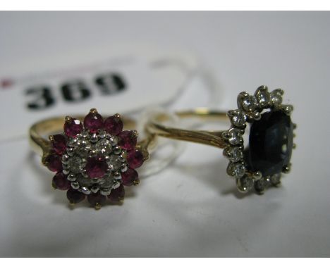 A 9ct Gold Ruby Set Cluster Dress Ring, claw set throughout: An Oval Cluster Dress Ring, claw set. (2)