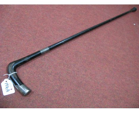 Ebonized Walking Stick, with silver ferrule and handle terminal.