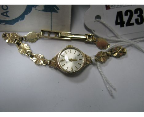 Accurist; A 9ct Gold Cased Ladies Wristwatch, the signed dial with line markers, to 9ct gold integral panel style bracelet, o