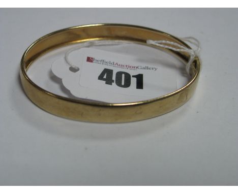 A 9ct Gold Panel Style Bangle, with engine turned foliate design, to snap clasp.