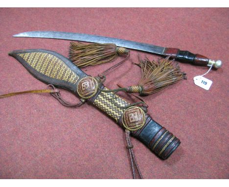 Bushman's Knife in the Polynesian Manner, having leather handle, in a straw work and leather scabbard, 69cm overall length.