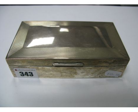 A Hallmarked Silver Cigarette Box, part engine turned, 15.6cm wide.