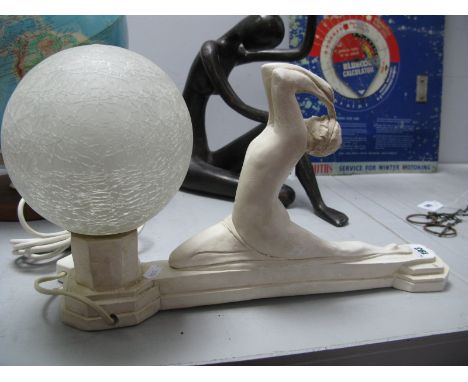 A Mid XX Century Plaster Art Deco Lamp of a lady holding a globe, 39.5cm long. 