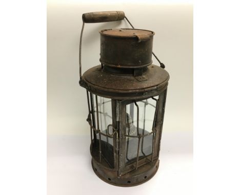 An antique lamp with paraffin burner.