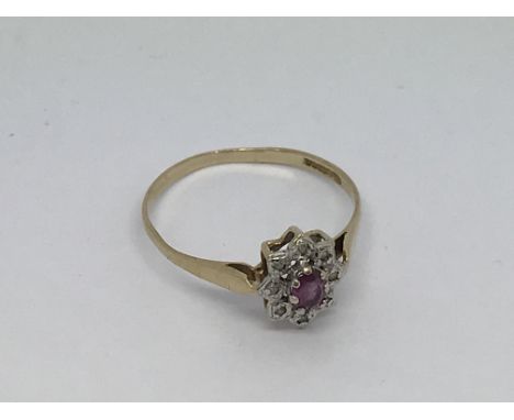 A 9ct gold ring set with ruby and small diamonds. Size r/s approx weight 1.3g