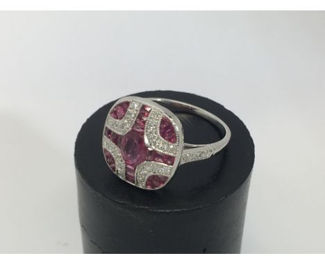 A platinum ruby and diamond Victorian style ring with a central oval cut ruby approx 0.44ct.