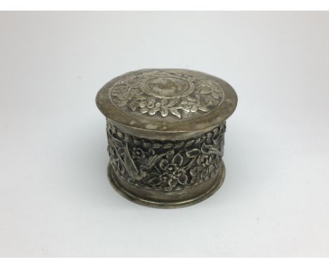 A silver circular box and cover by H Wilkinson of London, approx height 4cm.