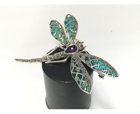 A sterling silver and marcasite plique au jour enamel dragonfly brooch/pendant.