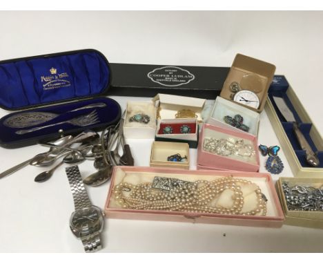 A collection of vintage silver and other costume jewellery cased silver plated cutlery a gents Timex watch and other oddments