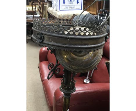 A Victorian Gothic brass telescopic lamp base with two other brass oddments.