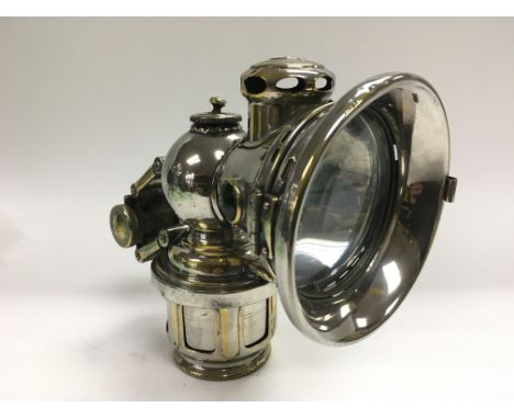 A Joseph Lucas Ltd 'King of the road' carbide bicycle lamp dated 1921.