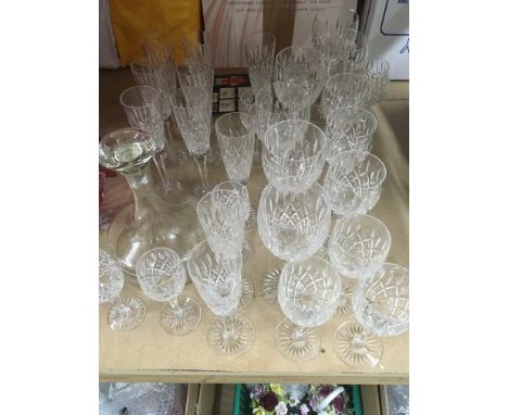 A collection of Stewart crystal including decanter and wine glasses .