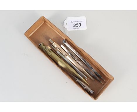 A selection of vintage propelling pencils including three silver examples