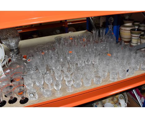 A GROUP OF CUT CRYSTAL AND GLASSWARE,  to include a miniature Edinburgh Crystal clock, an engraved decanter depicting a brick