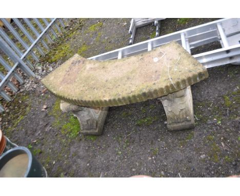 A MODERN CONCRETE CURVED GARDEN BENCH with detailed bases, length 125cm. Condition Report: no obvious damage