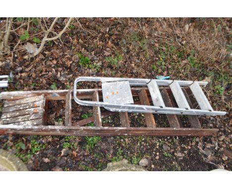 A MID CENTURY WOODEN STEP LADDER, height 195cm, and an aluminium step ladder (2). Condition Report: some losses to bottom of 