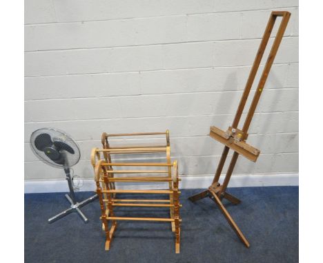 A BESPOKE PINE ARTIST EASEL, height 171cm, three towel rails, a folding table, and an electric fan, condition report: all wit