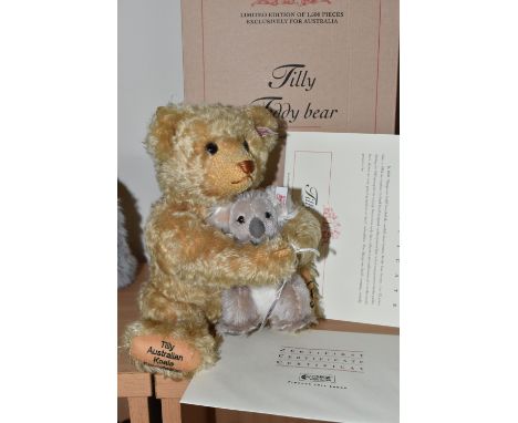 A BOXED STEIFF 'TILLY TEDDY BEAR' a limited edition 600/1500, exclusively designed for Australia, gently encircling a baby Ko