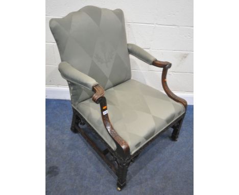 A GEORGE III STYLE GAINSBOROUGH ARMCHAIR, in the style of Chippendale, re-covered with green upholstery, the shaped crest to 