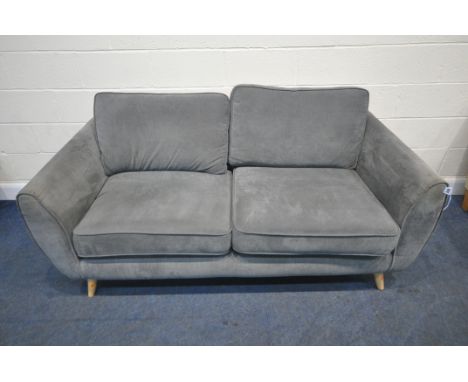 A GREY UPHOLSTERED TWO SEATER SOFA, raised on cylindrical tapered legs, length 188cm x depth 93cm x height 86cm, condition re