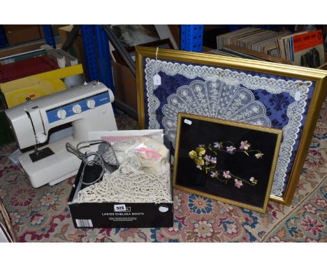 A BROTHER SEWING MACHINE MODEL VX-1200, with operation manual and charger, together with a framed embroidery depicting a vase