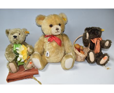THREE STEIFF COLLECTORS BEARS, comprising 'Spring' holding daffodils and 'Autumn' carrying a basket of apples, both with swin