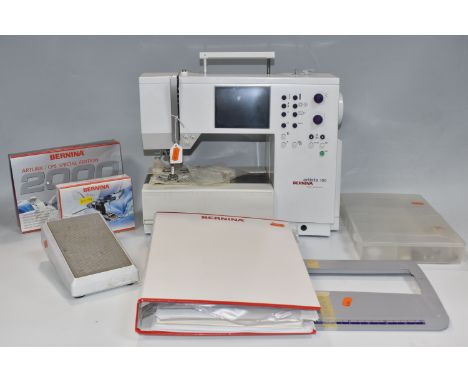 A BERNINA SEWING MACHINE,&nbsp; 'Artista' 180 electric sewing and embroidery machine, together with manual and various attach