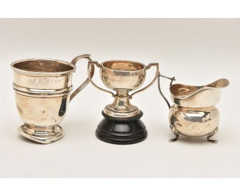 THREE ITEMS OF SILVER, to include an AF cup fitted with a scroll handle, hallmarked 'Lanson Ltd' Birmingham 1940,a cream jug 