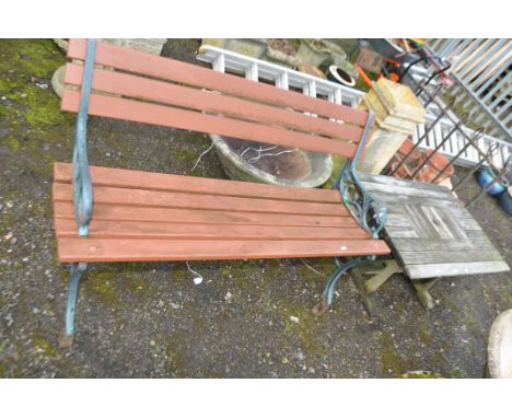 A MODERN CAST IRON ENDED GARDEN BENCH with slatted wood seat and back (feet have raisers welded to them) and a wooden occassi